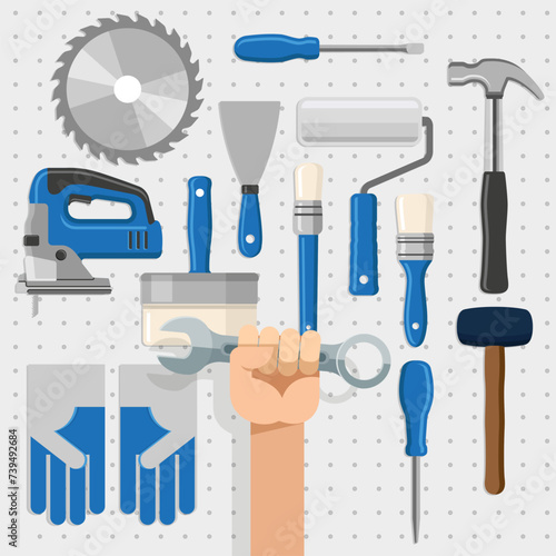 Painel de ferramentas de trabalho contendo serra, martelo, chave inglesa, quebra-cabeça, escova e espátula photo