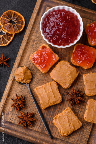 Delicious nutritious sandwiches with peanut butter, strawberry jam