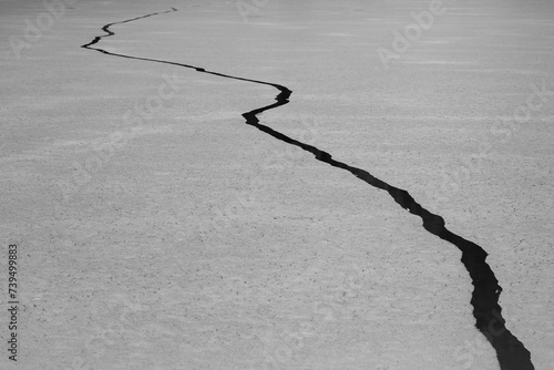 Abstract Crack in the Ice of Weissensee Lake in Carinthia, Austria Black and White photo