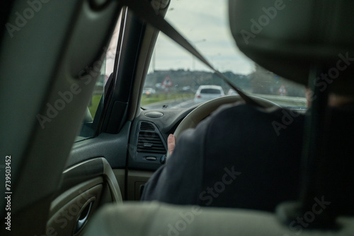 The Man Sitting in the Driver's Seat and the Road