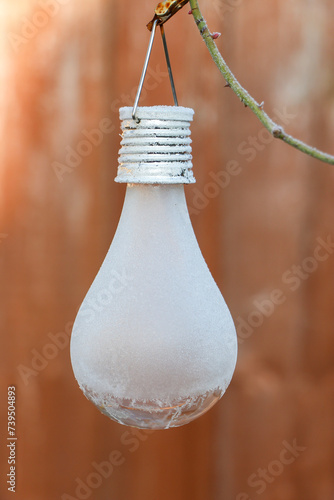 Solar lights in the garden chilled under the winter temperatures