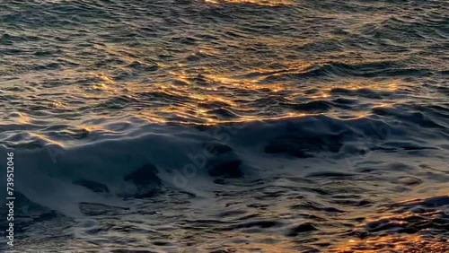 Waves crashing on the shore during sunset. Albania summer holidays.  photo