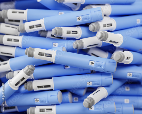 A large group of injectors / dosing pens  for subcutaneous injection of antidiabetic medication or anti-obesity medication on a heap. Selective focus. photo