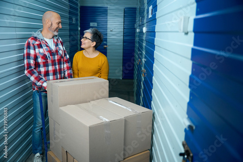 Two people look at each other while transporting things