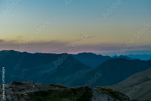 Panoramic sunset view of majestic mountain peaks in High Tauern National Park, Salzburg Carinthia border, Austria. Tranquil atmosphere in remote Austrian Alps. Looking from cottage Hagener Huette