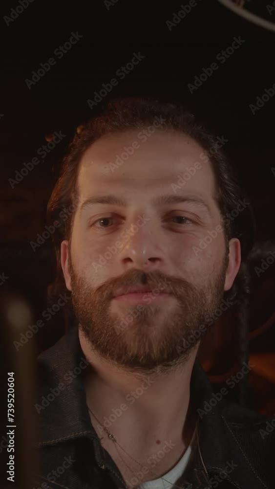 Joyful Moments: Smiles of Young Man Video Call Talking in a Night Lighted House. Vertical video Joyful Moments: Smiles of Young Man Video Call Talking in a Night Lighted House. Vertical video