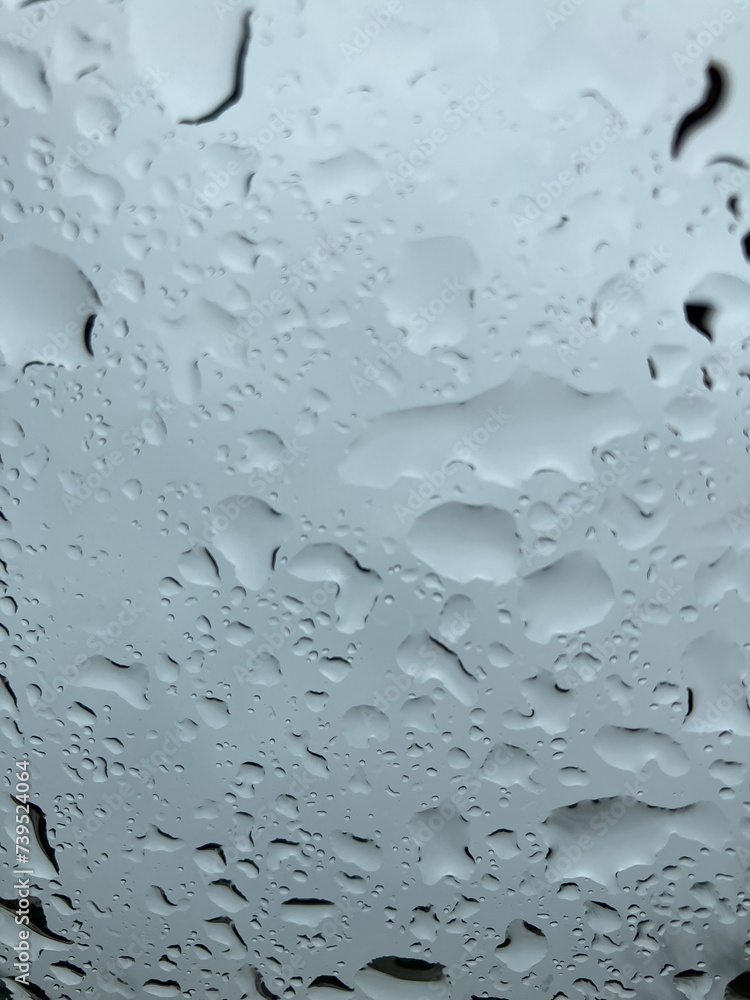 Raindrops evenly distributed on a glass window - nice for background Raindrops evenly distributed on a glass window - nice for background