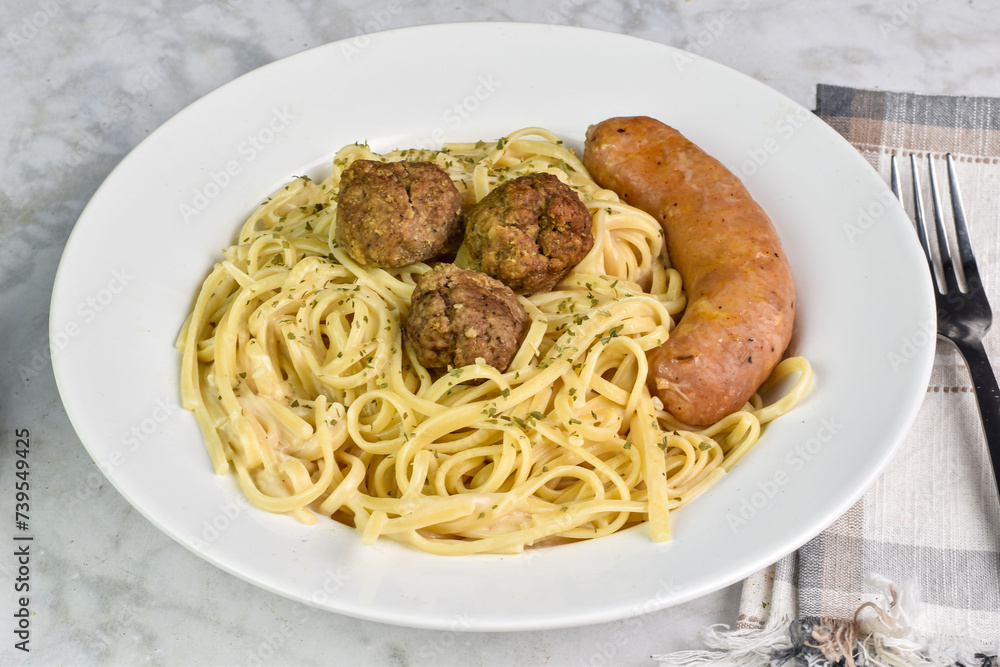 linguine in alfredo sauce with meat balls and italian sausage linguine in alfredo sauce with meat balls and italian sausage