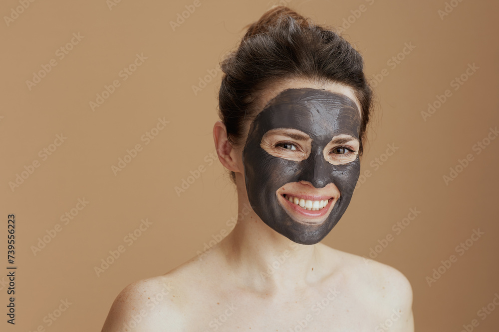 smiling modern female with cosmetic mask smiling modern female with cosmetic mask
