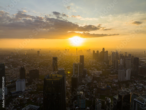 Fototapeta Naklejka Na Ścianę i Meble -  Jakarta city and skyscrapers at sunset. Urban landscape. Indonesia.