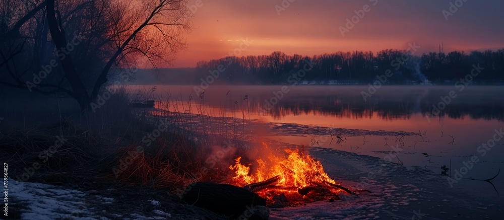 Fiery Blaze on Water: Stunning Fire Burning in the Middle of a Tranquil Lake Fiery Blaze on Water: Stunning Fire Burning in the Middle of a Tranquil Lake