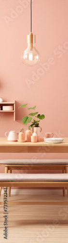 Minimalistic pink still life with plates, cups and a plant on a wooden table. © amiraaziadi