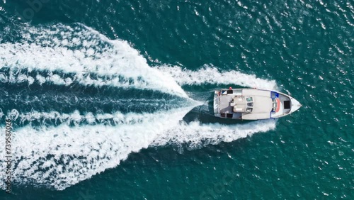 Wallpaper Mural Top down small ship sailing fast leaving trace of white foamy waves tail in green water. Ocean cruise in Oahu island shore. Hawaii active tourism background. Tourist attraction on small boat in ocean Torontodigital.ca