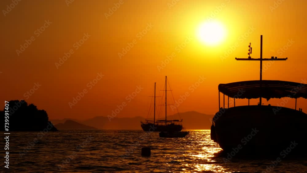 Boats with no tourists during evening. A view of anchored boats in the small harbor during sunset time. Boats with no tourists during evening. A view of anchored boats in the small harbor during sunset time.