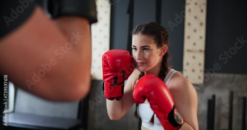 Sports, fitness or boxing with woman and personal trainer at gym for training, practice or spar in preparation for fight. Exercise, health or workout with boxer and coach together for self defense