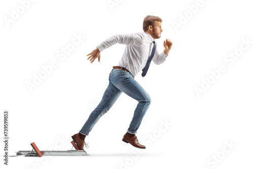 Full length profile shot of a white collar worker running from starting blocks photo