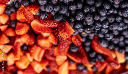 Blueberries and strawberries as a background. Close up.  © astaszczyk