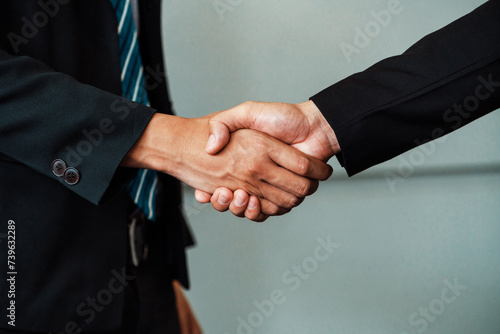 Business people agreement concept. Businessman do handshake with another businessman in the office meeting room. uds © Summit Art Creations