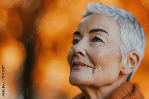 Mature woman in a park with...