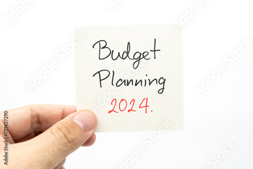Budget Planning 2024 text message by hand writing on paper note. Budget planning concept.