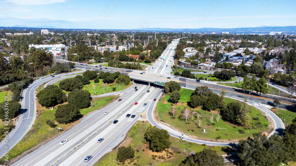 Aerial view of a light weekend traffic on Highway 85 and El Camino Real junction in Mountain View, California. Looking toward San Francisco Bay