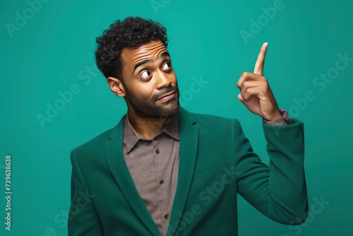 new ideas vibrant portrait of multiracial man pointing finger up and looking away solution found. one color background - generative ai