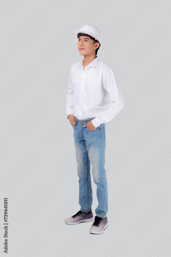 Portrait young asian man is engineer wearing helmet standing and smiling with confident isolated on white background, handsome male is architect or contractor, worker or labor, industrial concept. Portrait young asian man is engineer wearing helmet standing and smiling with confident isolated on white background, handsome male is architect or contractor, worker or labor, industrial concept.
