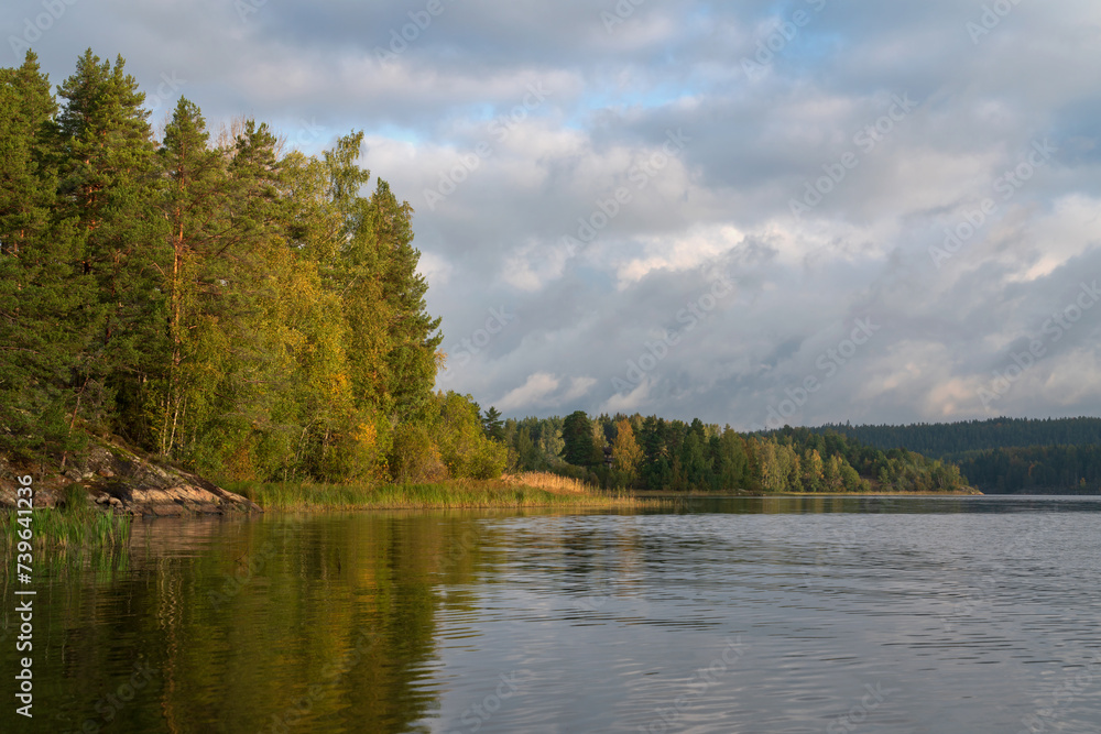 Fototapeta premium Lake Ladoga near the village Lumivaara on a sunny autumn day, Ladoga skerries, Lakhdenpokhya, Republic of Karelia, Russia