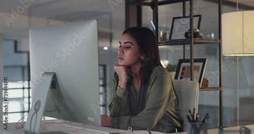 Businesswoman, typing and desktop in modern office with working, sigh and online project with research in workplace. Consultant, computer or professional in concentration on website or focus at night