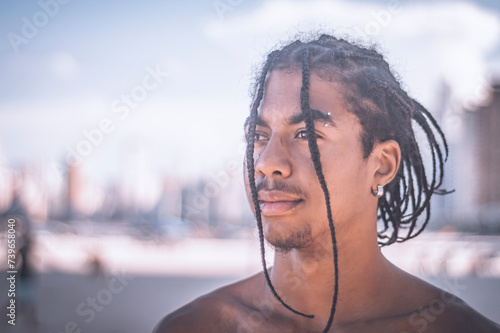 17 year old afro descendant teenager with braids in hair and no shirt, various facial expressions, lifestyle concept, coppy space photo