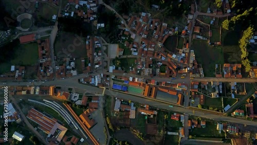 Top Down View Over Poroy in Peru with Warm Sunlight Over Buildings and Roads. photo