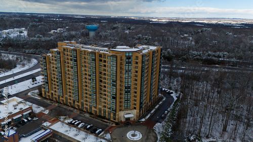 Large building overlooking snowy landsacape. photo