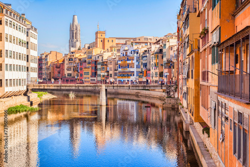 Fotomurale Girona, Spain - Medieval houses on the banks of the River Onyar, and the Pont de Sant Agusti, and the bell tower of Sant Feliu Collegiate Church, Girona, Catalonia, Spain