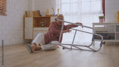 Asian senior elderly female fall on the ground while walk alone in house. 