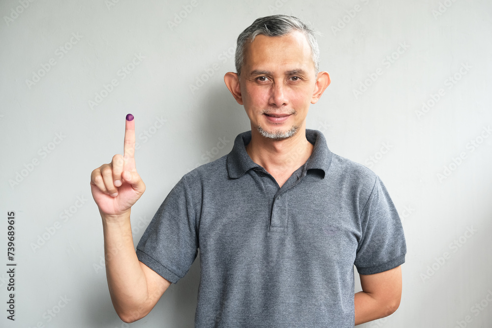Purple ink applied on finger after pemilu or presidential election in Indonesia
Purple ink applied on finger after pemilu or presidential election in Indonesia