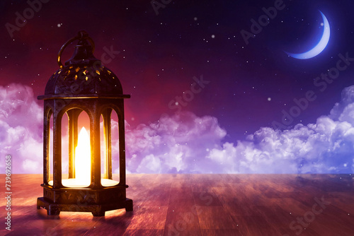 Shiny arabic lantern on wooden floor at beautiful blue night sky with cloud  stars and crescent moon  Ramadan kareem background