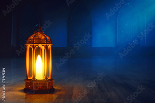 Arabic lantern in the mosque window arch at night, Ramadan kareem background