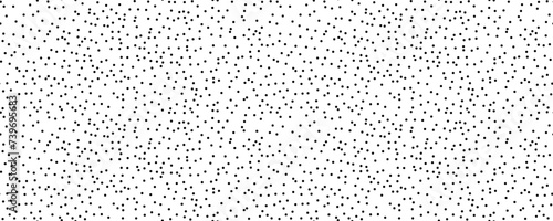 Polka dot seamless pattern. Creative texture of chaotic round shapes. Vector illustration of small black circles on white background. Dotted wrapping paper sample.