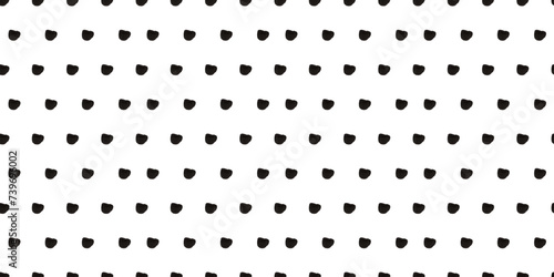 Seamless polka dot pattern: Vector illustration with small black freeform dots on a white backdrop. Creative texture of chaotic triangular and round shapes. Cute dotted wrapping paper sample.
