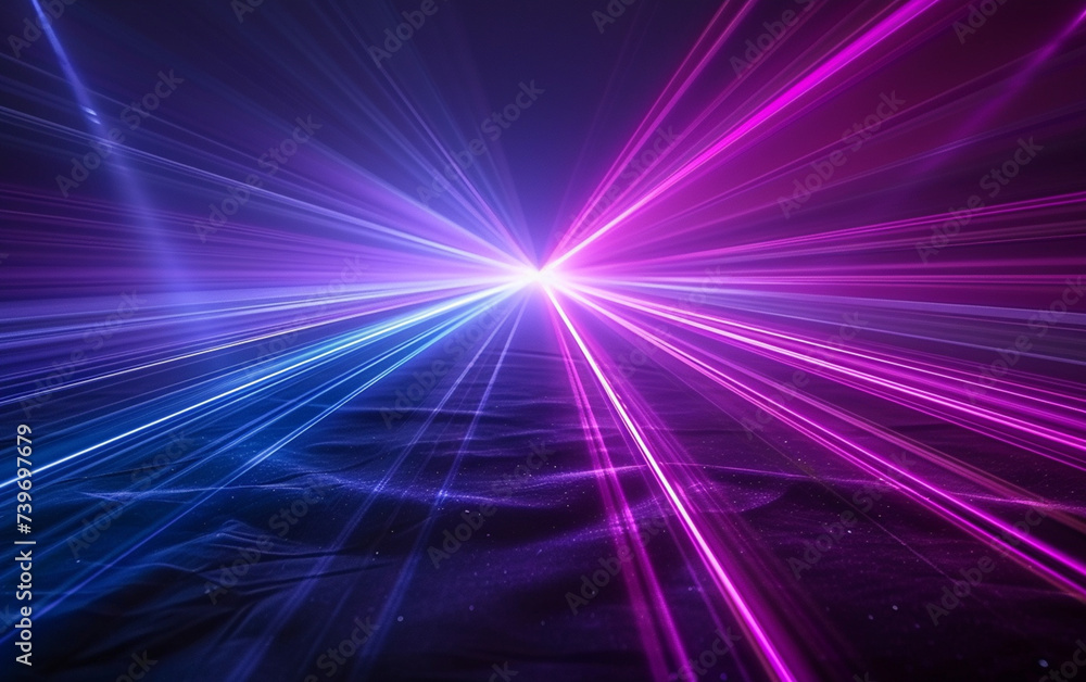 Blue and violet beams of bright laser light shining on black background