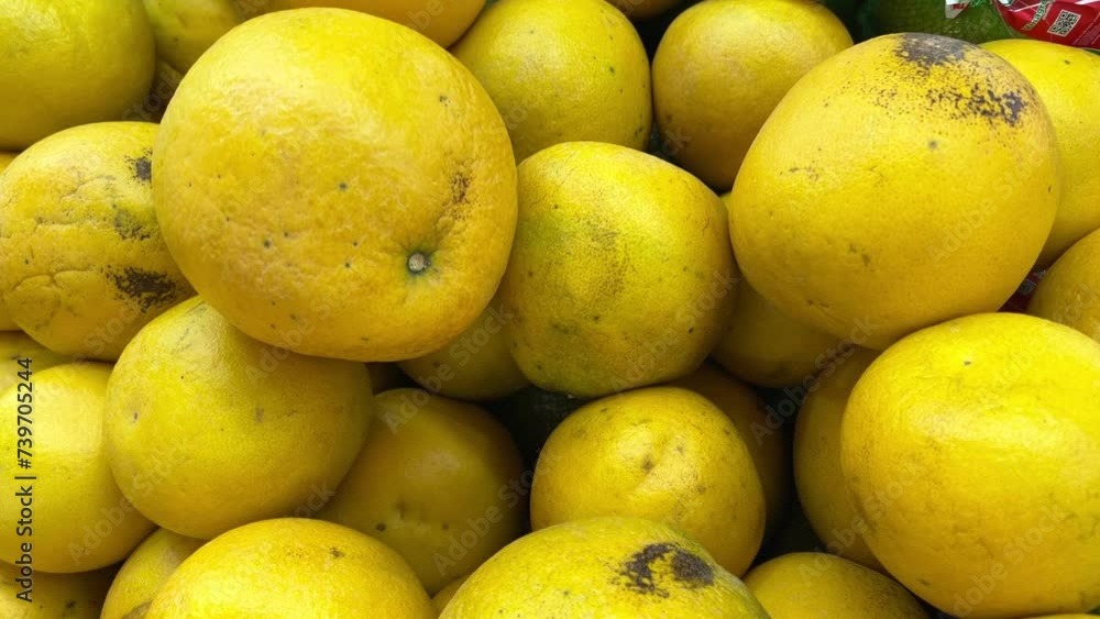 vegetables and fruits on the counter in a supermarket or market in Vietnam close-up of Fresh whole yellow lemons for the market. slow camera movement Fresh grapefruits vegetables and fruits on the counter in a supermarket or market in Vietnam close-up of Fresh whole yellow lemons for the market. slow camera movement Fresh grapefruits