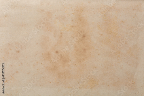 abstract of old discolored book page background, historical and vintage faded with spots or stain creamy or yellowed hue or torn, warmth and depth wallpaper or backdrop for graphic design, blank space photo