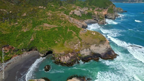 Aerial view establishing mountains with nalcas and the time pier at tepuhueico park in Cucao, Chiloe Chile photo