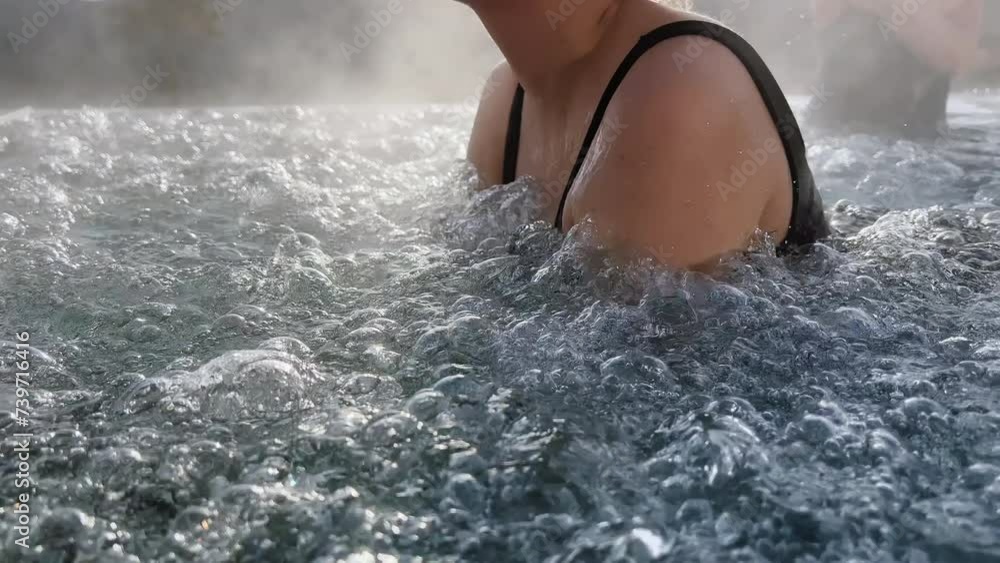 Spa on holidays. Women relaxing in outdoor hot pool. Mountain view in winter day Spa on holidays. Women relaxing in outdoor hot pool. Mountain view in winter day