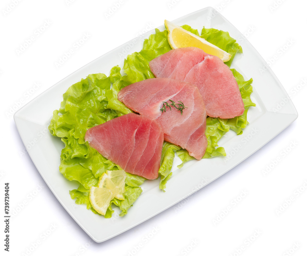 Fresh tuna Fish steak on a ceramic plate isolated on white background Fresh tuna Fish steak on a ceramic plate isolated on white background