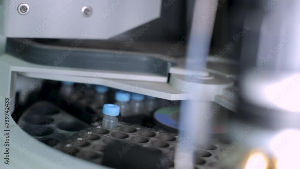 Placing a Solution Sample in Laboratory Centrifuge, Close Up Placing a Solution Sample in Laboratory Centrifuge, Close Up