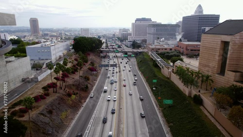 Drone Shot of US-101 Highway Traffic in Downtown Los Angeles USA, Santa Ana Fwy and County Court Buildings photo