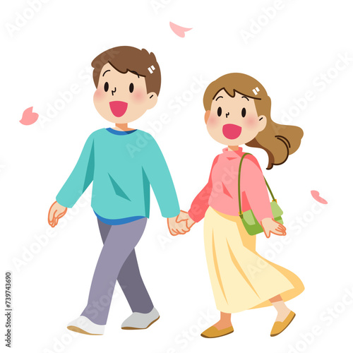 春に桜を見ながら散歩するカップル