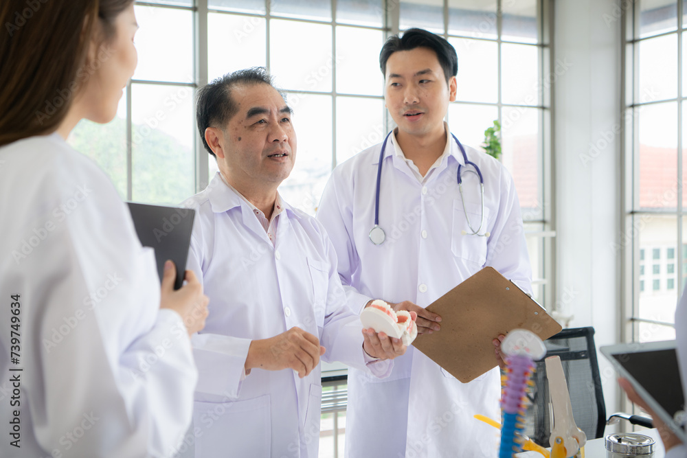 A medical professor is lecturing on a case study related to oral and dental treatment to medical students A medical professor is lecturing on a case study related to oral and dental treatment to medical students