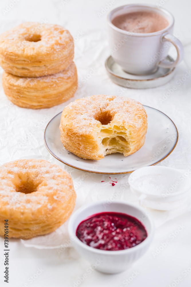 Cronuts - delicious fusion of croissant and donut with raspberry jam. Cronuts - delicious fusion of croissant and donut with raspberry jam.